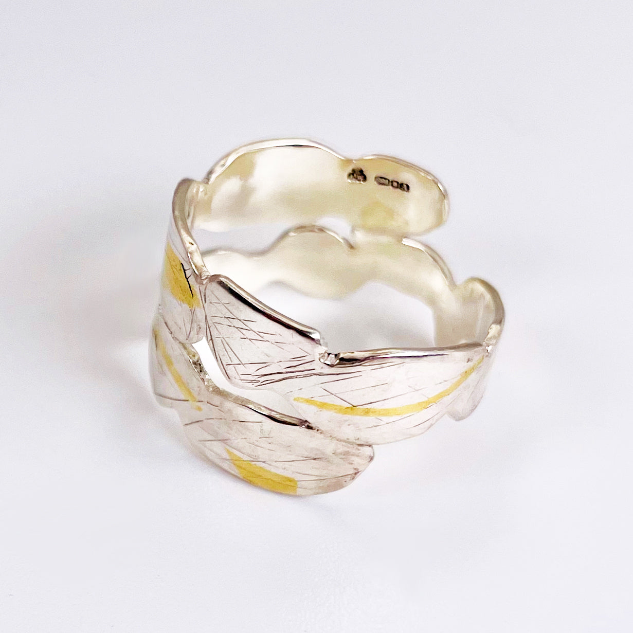 Expanded Skies Bone Tor Ring with 24ct Gold Accents is inspired by the contours and forms of Dartmoor’s Bone Tor, near Widdecombe on the Moor, at sunset. Fine silver with 24ct gold accents.