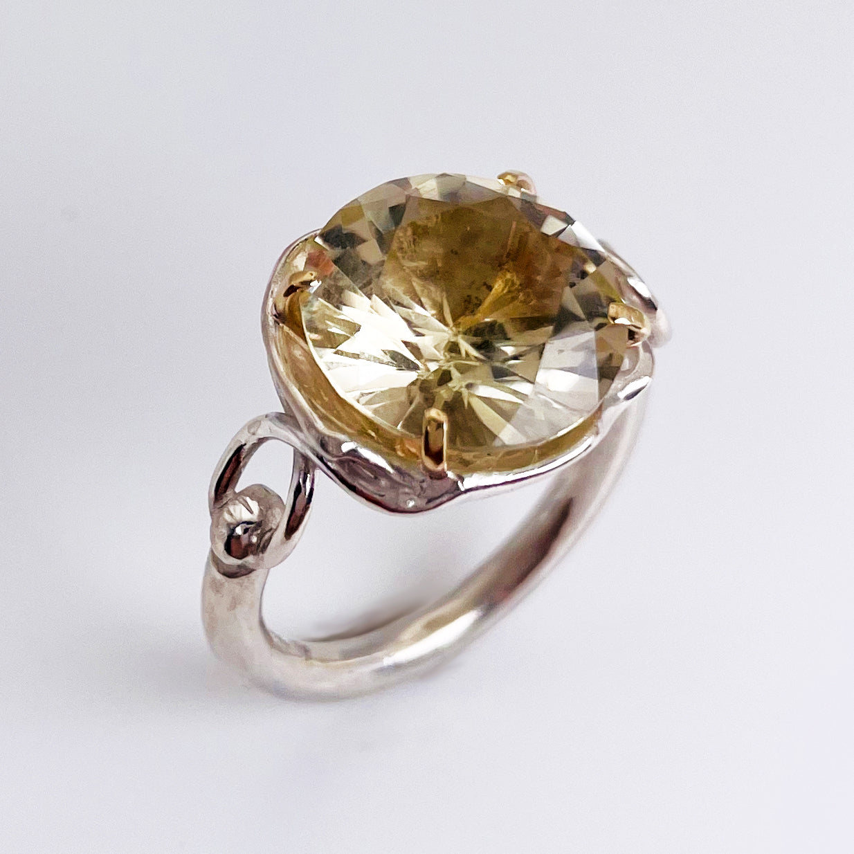The Expanded Skies Sun Over High Moor Citrine Ring evokes the dazzling pale midsummer sun over Dartmoor’s High Moor, evoked by a beautiful citrine in sculpted undulating setting in sterling silver with 9ct gold claws.