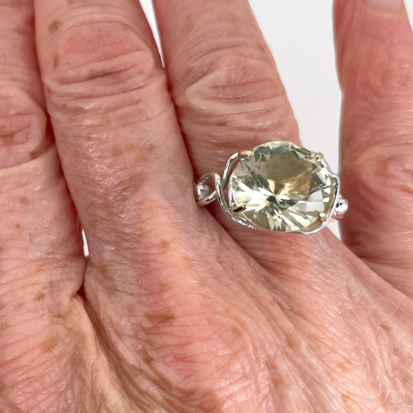 The Expanded Skies Sun Over High Moor Citrine Ring evokes the dazzling pale midsummer sun over Dartmoor’s High Moor, evoked by a beautiful citrine in sculpted undulating setting in sterling silver with 9ct gold claws. Worn on hand