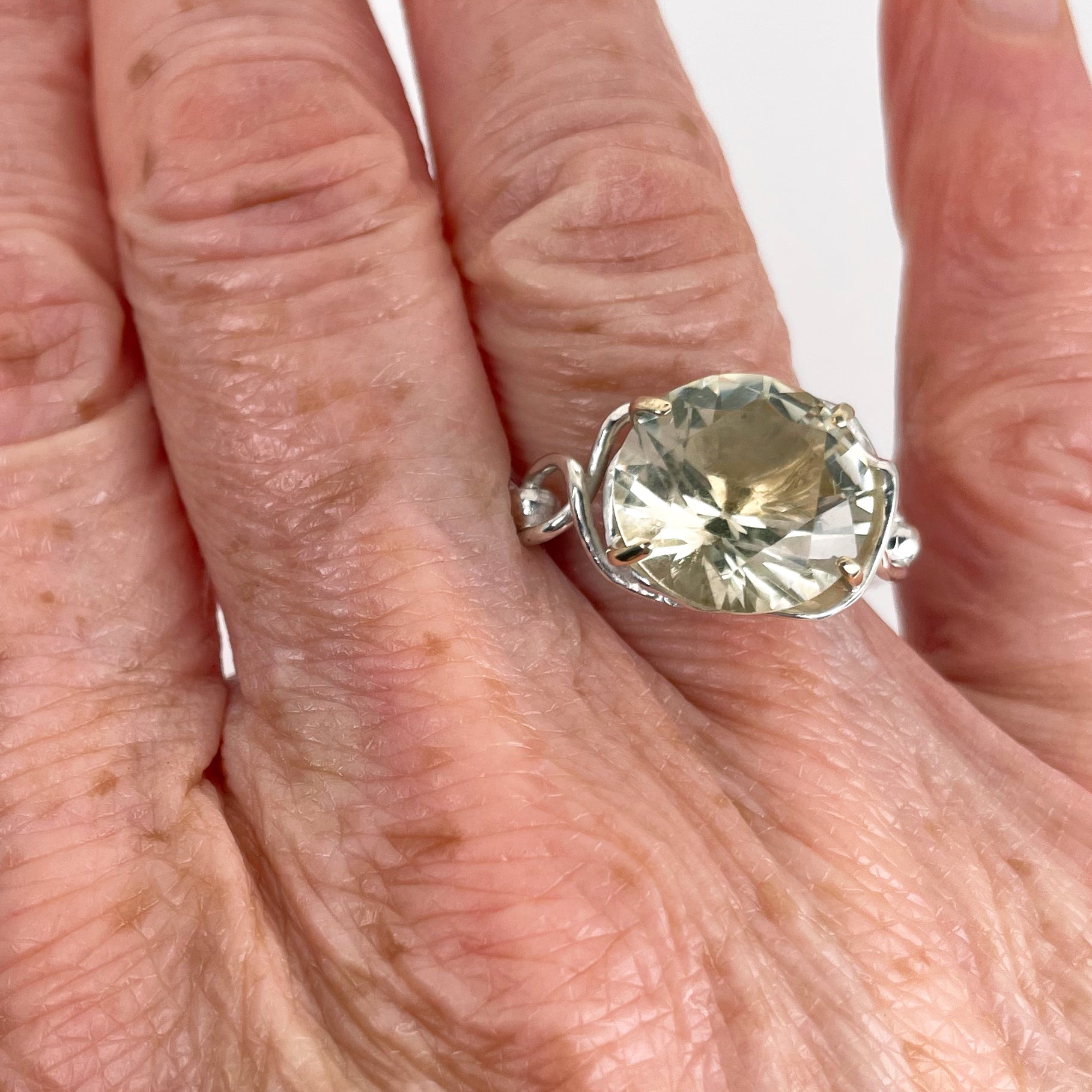 The Expanded Skies Sun Over High Moor Citrine Ring evokes the dazzling pale midsummer sun over Dartmoor’s High Moor, evoked by a beautiful citrine in sculpted undulating setting in sterling silver with 9ct gold claws. Worn on hand