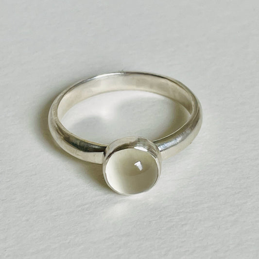 The Full Moon Moonstone Ring has a tranquil beauty of the light of the full moon reflected on a still pool. Totally handcrafted, it features an ethically mined moonstone from Sri Lanka set in quality 100% recycled sterling silver. 