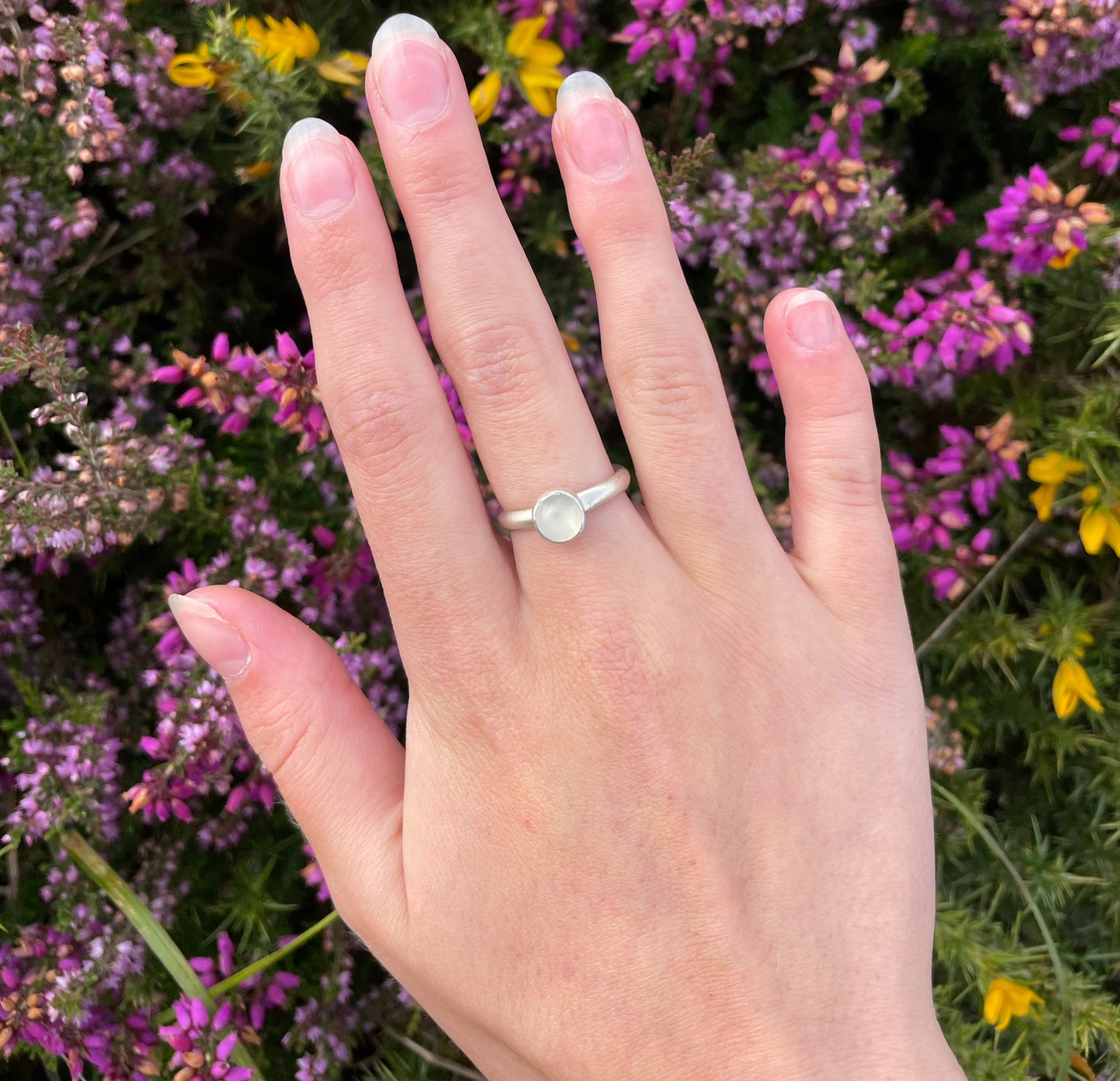 The Full Moon Moonstone Ring has a tranquil beauty of the light of the full moon reflected on a still pool. Totally handcrafted, it features an ethically mined moonstone from Sri Lanka set in quality 100% recycled sterling silver. 