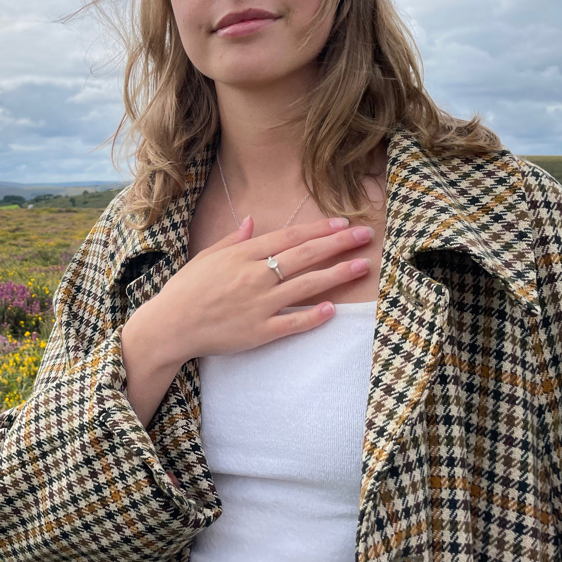 The Full Moon Moonstone Ring has a tranquil beauty of the light of the full moon reflected on a still pool. Totally handcrafted, it features an ethically mined moonstone from Sri Lanka set in quality 100% recycled sterling silver. 