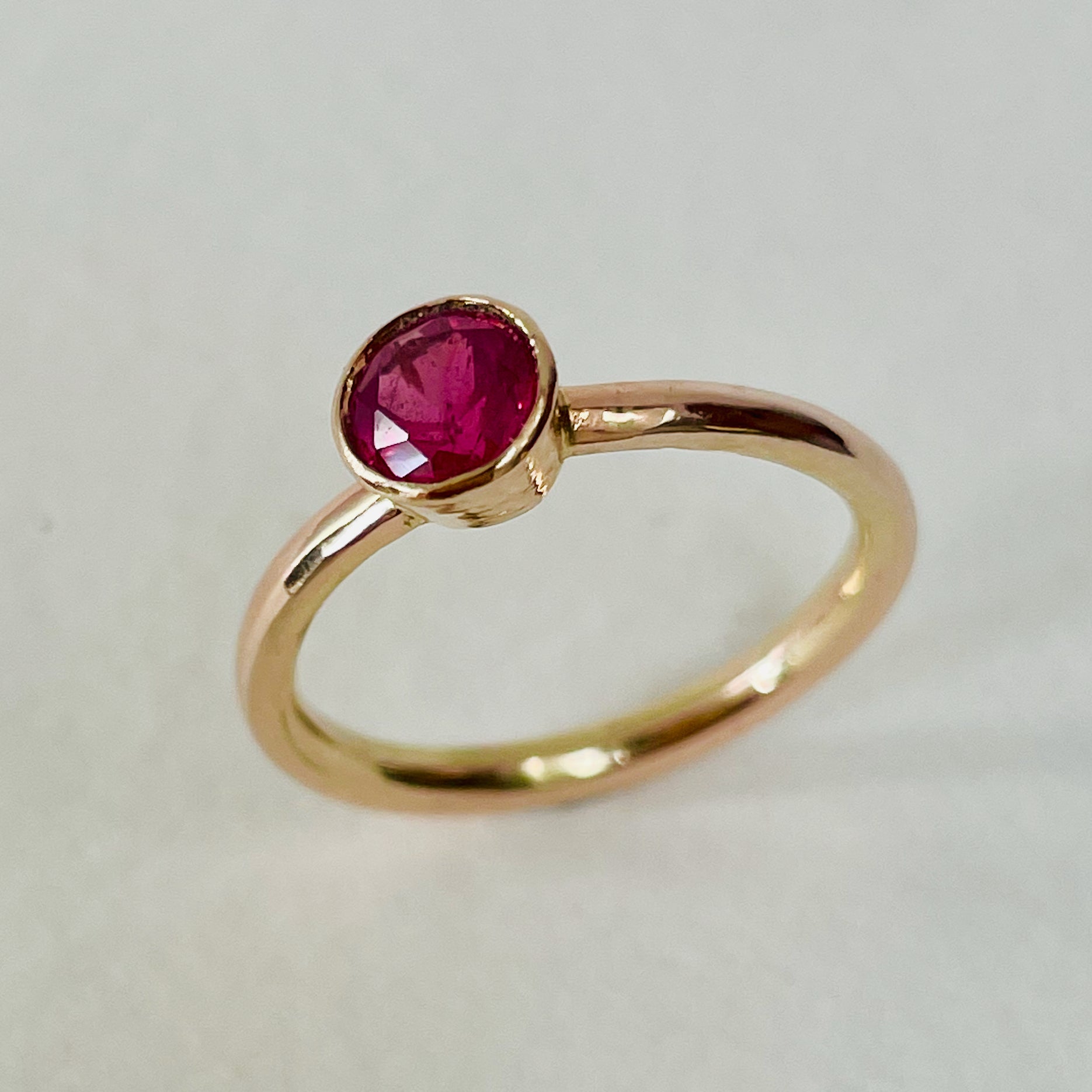 The Ruby Chalice Ring has a stunningly beautiful ethically sourced Tanzanian deep pink-red ruby, encircled with 18ct rose gold tapered chalice on a 9ct rose gold band. This totally handcrafted piece makes a wonderful gift, engagement ring or perfect encapsulation of love and joy.