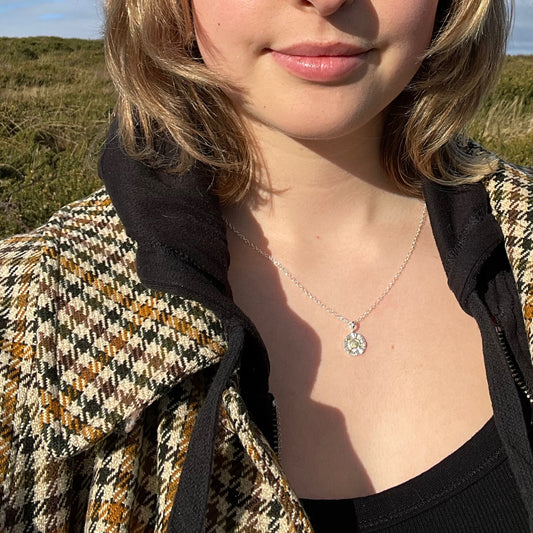 The Radiant Sun Pendant with 22ct gold is joyful! Hand sculpted in recycled solid fine silver (999) with a textured surface and a twinkly beauty all of its own. 22ct heavy gold foil is applied using a traditional Korean gilding technique that makes each piece unique.