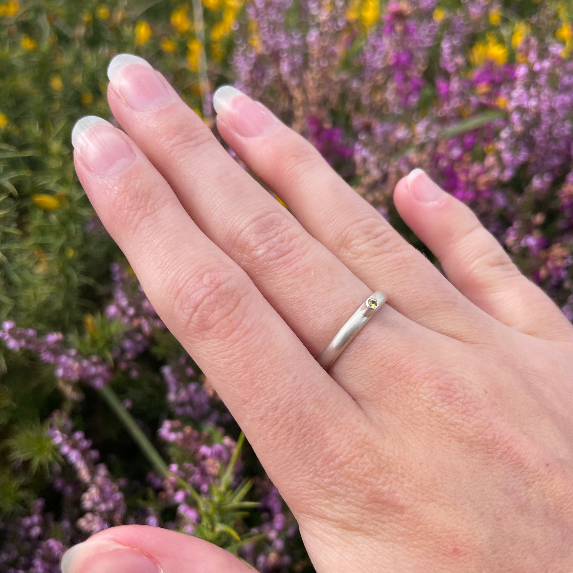 The Sun Beam Yellow Sapphire ring has the clear and simple beauty of golden yellow ethically mined Sri Lankan yellow sapphire set on a matt silver sterling silver band. Understated and beautiful, it can be worn everyday or for special occasions.