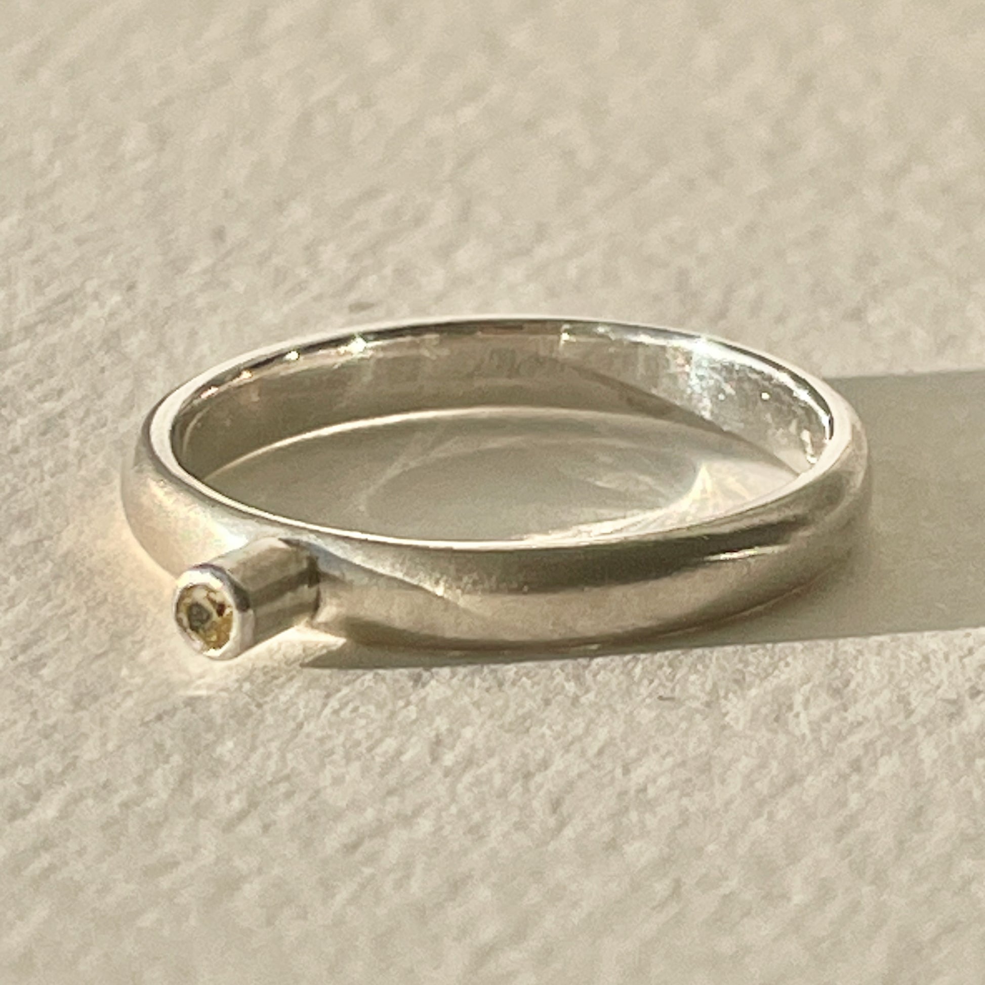 The Sun Beam Yellow Sapphire ring has the clear and simple beauty of golden yellow ethically mined Sri Lankan yellow sapphire set on a matt silver sterling silver band. Understated and beautiful, it can be worn everyday or for special occasions.