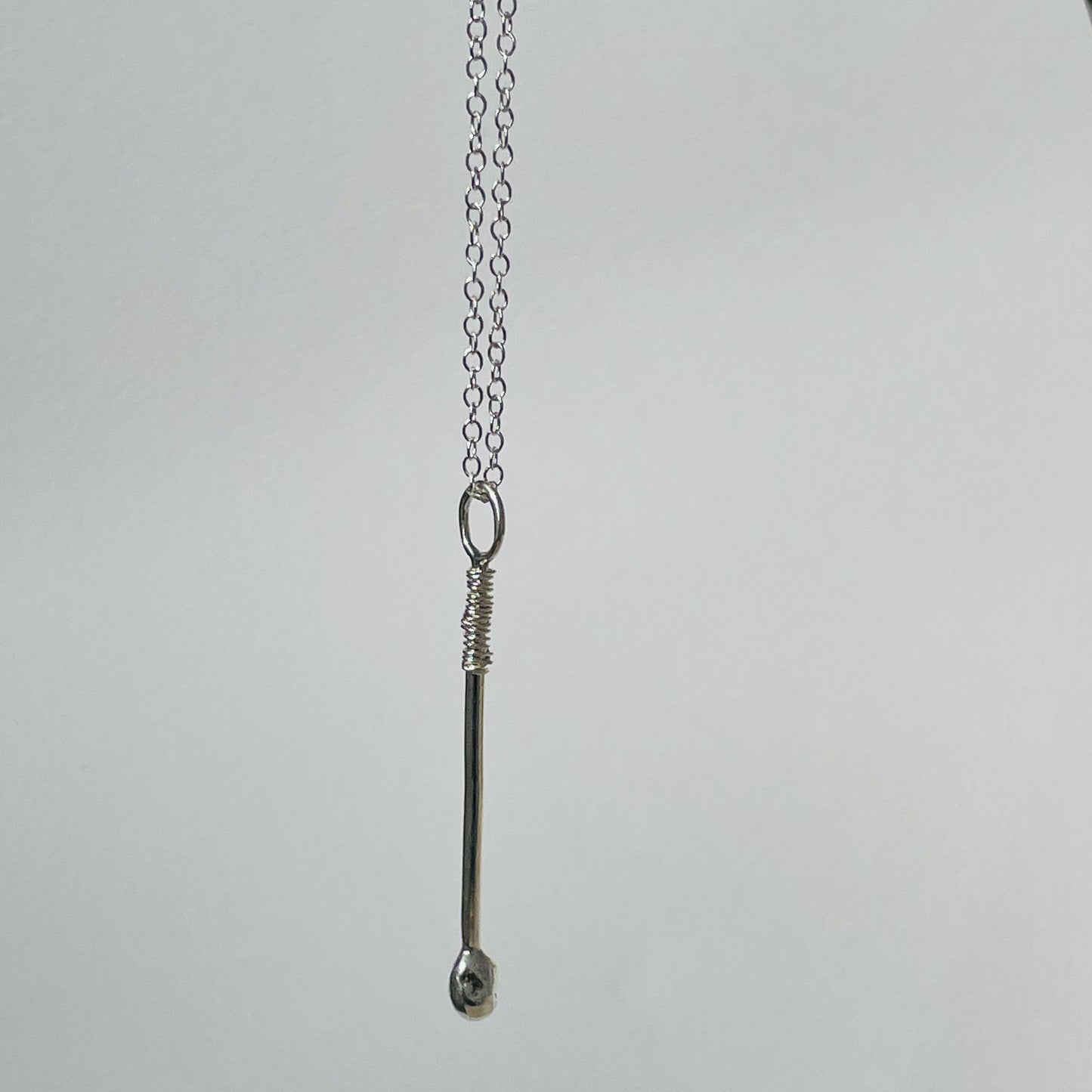 07886022942  The Expanded Skies Ceremonial Drum Stick Pendant has a distinctive design yet is subtle and easy to wear. Handcrafted with a high quality recycled sterling silver (925) shaft and a fine silver (999) drum stick tip.  It is accompanied by a sterling silver chain, available in a range of lengths or a hand strung fine glass seed bead necklace made from beautiful Japanese Miyuki glass seed beads, available in green.