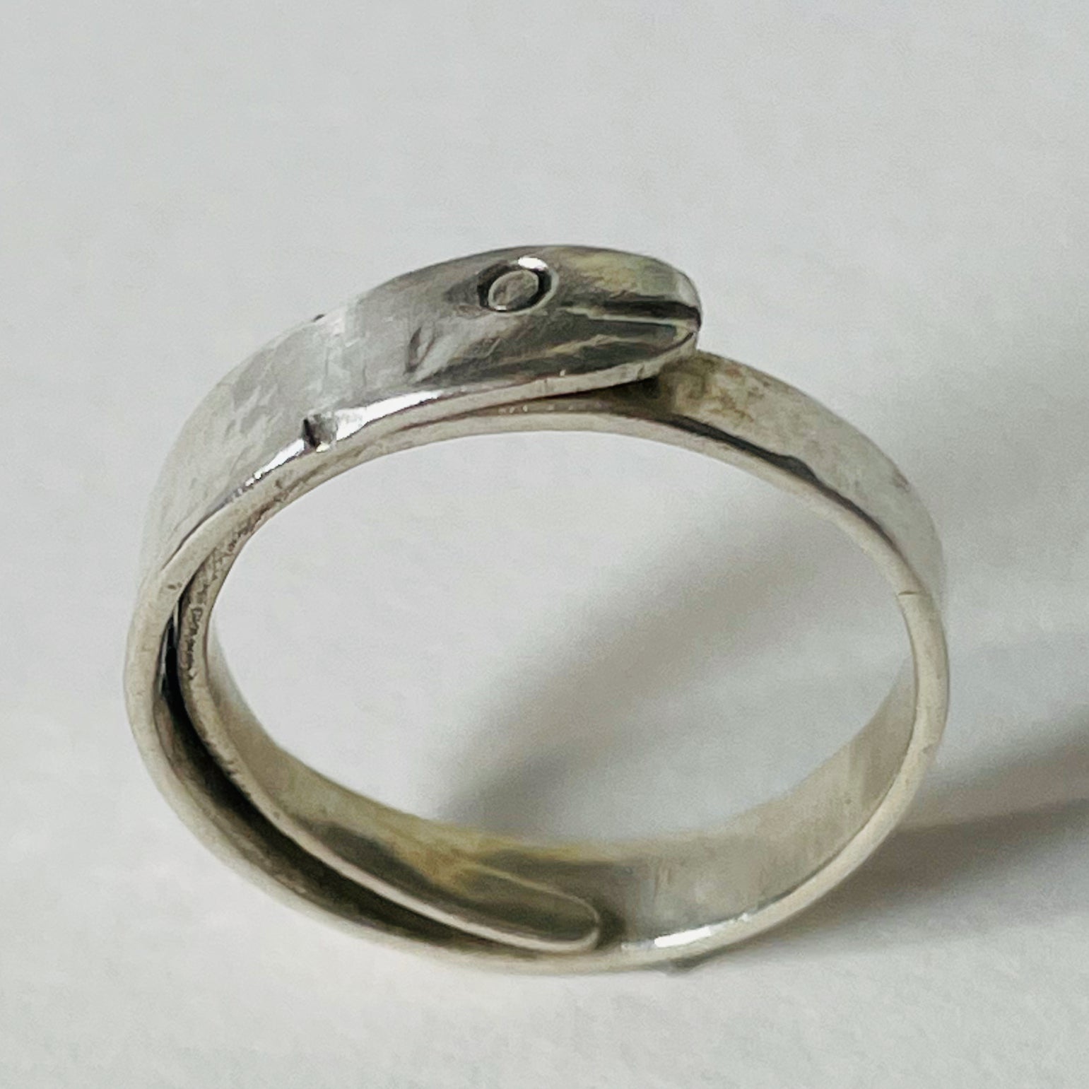 The Expanded Skies Ouroboros Snake ring is totally handcrafted in 100% recycled sterling silver, with etched details.  The ouroboros, the snake or dragon eating its tail, is an ancient Egyptian, Greek, Chinese and also a medieval alchemical symbol. The ouroboros represents the cycle of life and eternal renewal. The ouroboros reminds us that all of life is energy and energy doesn't disappear, it transforms.